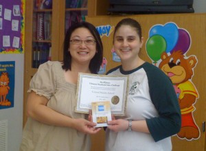 centralms Here's Julie getting her $100 American Express Gift Card for coming in 2nd Place in the Ultimate Sales Challenge. (*Excuse our dress. We were sorting yearbooks for distribution!)
